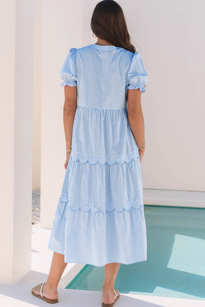 “Scallop-tier sky-blue striped dress, modest length”