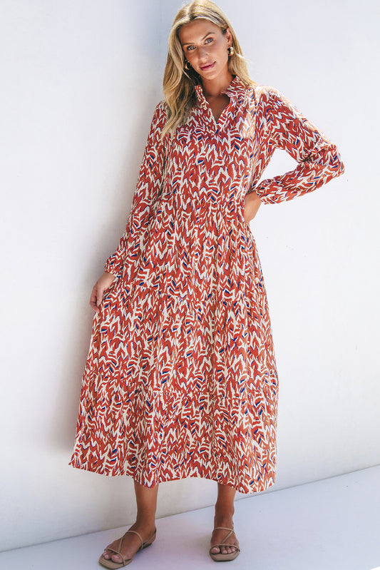 Woman wearing a red and white patterned maxi dress against a white background